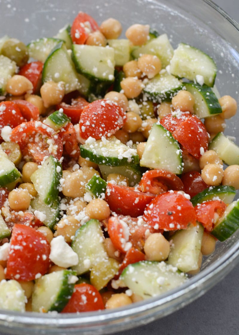 This Healthy Chickpea Salad is packed with chopped cucumbers, cherry tomatoes, chickpeas, feta and tossed in a simple lemon vinaigrette.