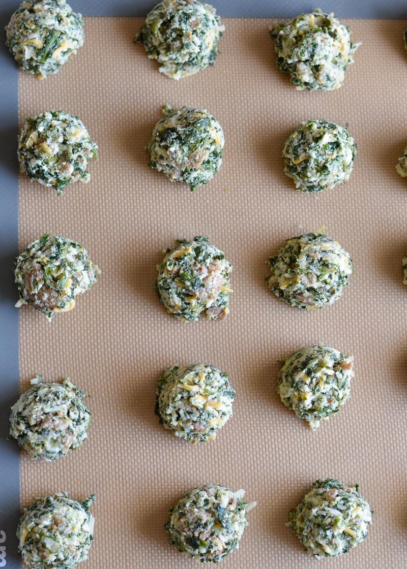 Try these Spinach and Cheese Bites for a savory snack! Loaded with spinach, sausage, and cheese these easy low carb bites make a great keto lunch! Each cheesy bite is under 1 net carb! 