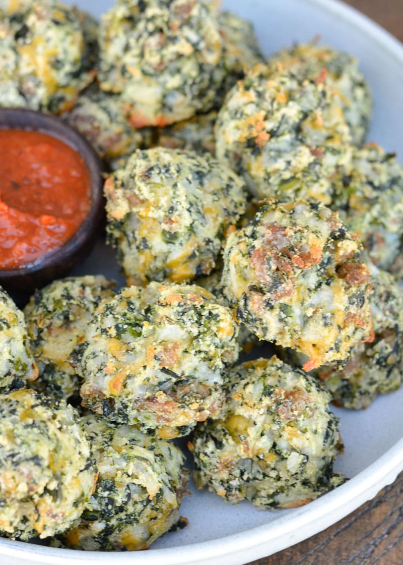 Try these Spinach and Cheese Bites for a savory snack! Loaded with spinach, sausage, and cheese these easy low carb bites make a great keto lunch! Each cheesy bite is under 1 net carb! 