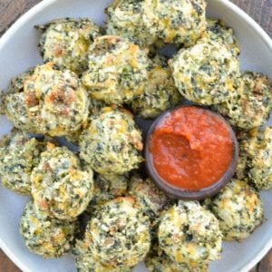 Try these Spinach and Cheese Bites for a savory snack! Loaded with spinach, sausage, and cheese these easy low carb bites make a great keto lunch! Each cheesy bite is under 1 net carb! 