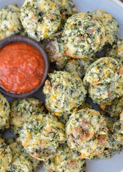 Try these Spinach and Cheese Bites for a savory snack! Loaded with spinach, sausage, and cheese these easy low carb bites make a great keto lunch! Each cheesy bite is under 1 net carb! 