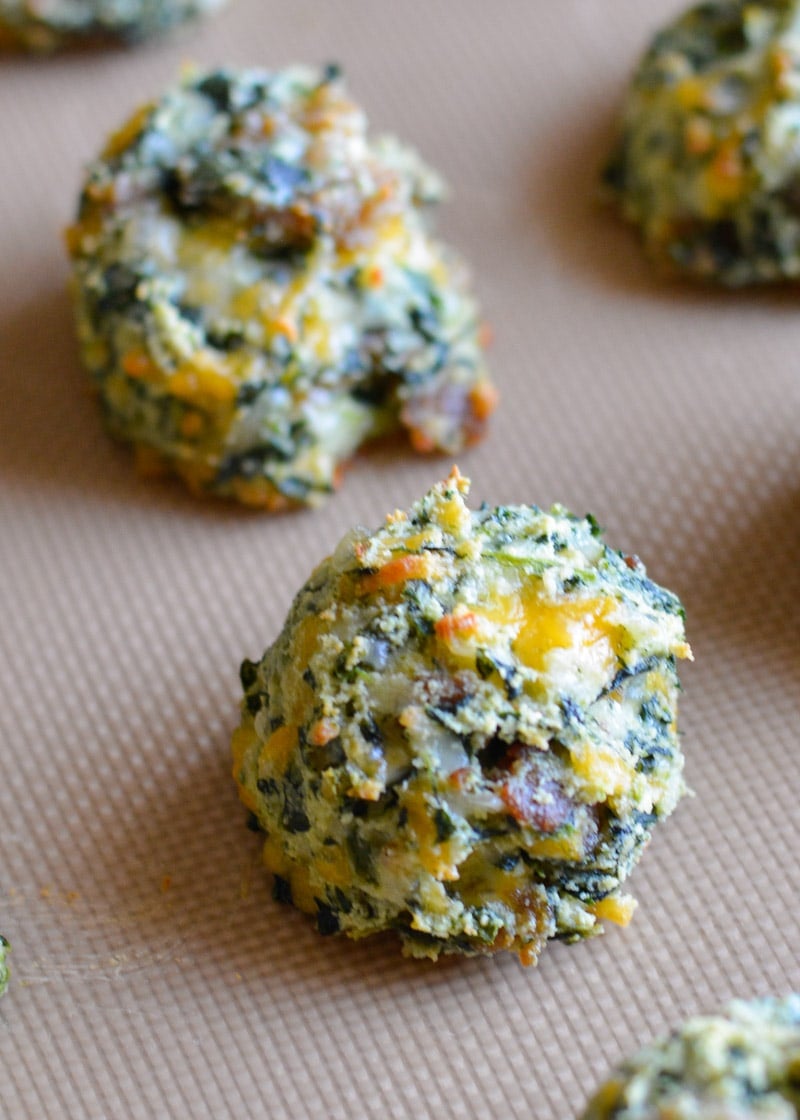 Try these Spinach and Cheese Bites for a savory snack! Loaded with spinach, sausage, and cheese these easy low carb bites make a great keto lunch! Each cheesy bite is under 1 net carb! 