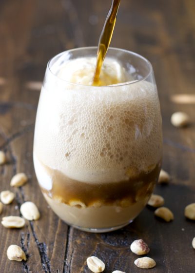 Sweet and creamy Peanut Butter Fudge sauce is paired with Vanilla Bean ice cream and fizzy Dr. Pepper for the ultimate Summer float!