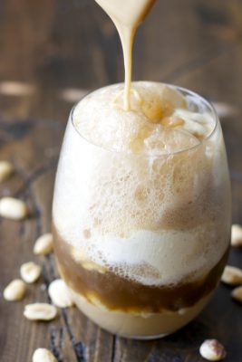 Sweet and creamy Peanut Butter Fudge sauce is paired with Vanilla Bean ice cream and fizzy Dr. Pepper for the ultimate Summer float!