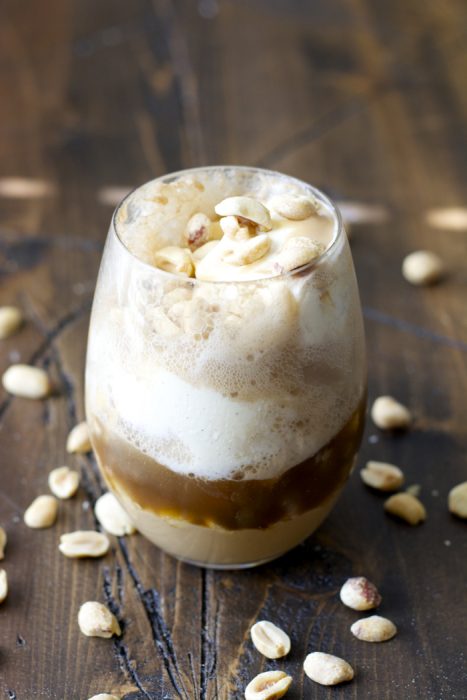 Sweet and creamy Peanut Butter Fudge sauce is paired with Vanilla Bean ice cream and fizzy Dr. Pepper for the ultimate Summer float!