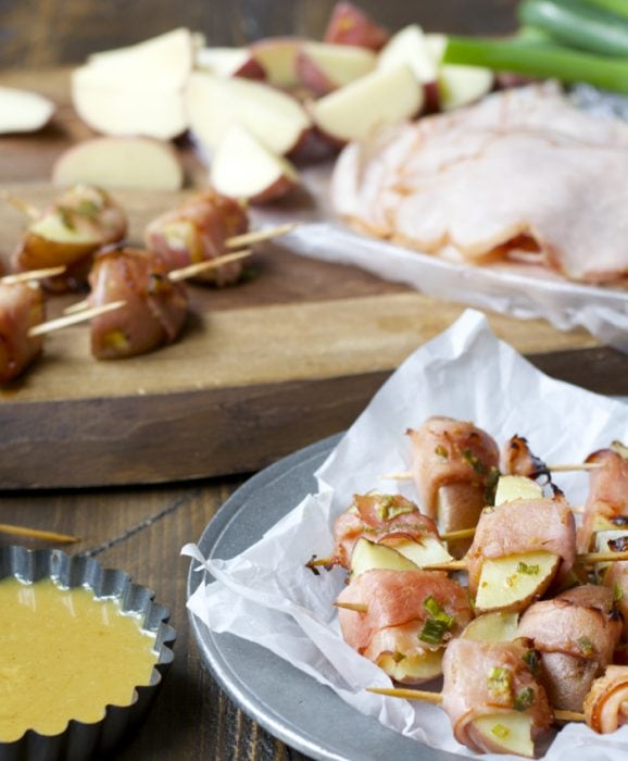 These Ham Wrapped Roasted Potatoes are served with Smokey Honey Mustard for a new and exciting appetizer! The perfect game day treat!