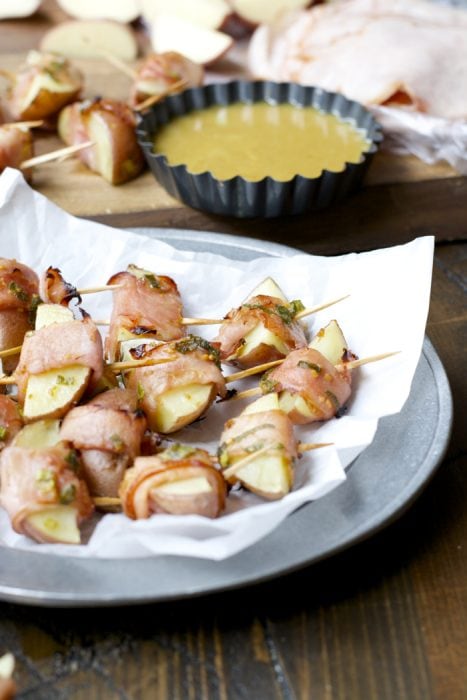 These Ham Wrapped Roasted Potatoes are served with Smokey Honey Mustard for a new and exciting appetizer! The perfect game day treat!
