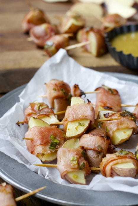 These Ham Wrapped Roasted Potatoes are served with Smokey Honey Mustard for a new and exciting appetizer! The perfect game day treat!