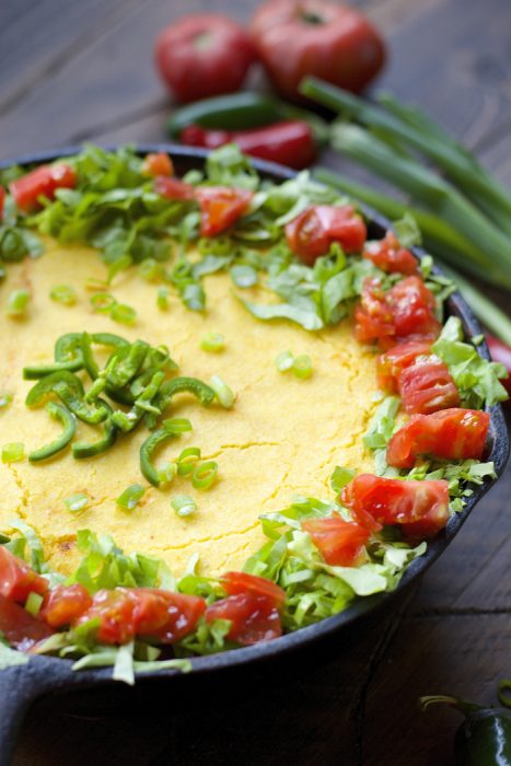 cornbread chili pie in a cast iron skillet 