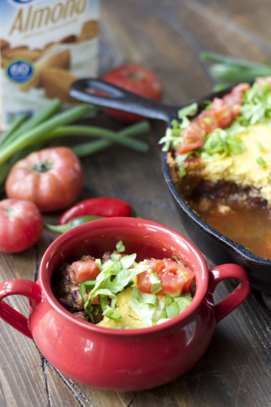 serving of chili cornbread bake in a red bowl. 