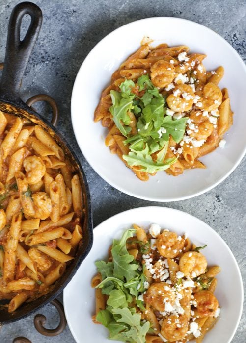 One Pan Shrimp Pasta with Feta! Ready in under 15 minutes! This simple one pan pasta dish is easy enough for a weeknight meal but fancy enough for a dinner party! And gluten free!