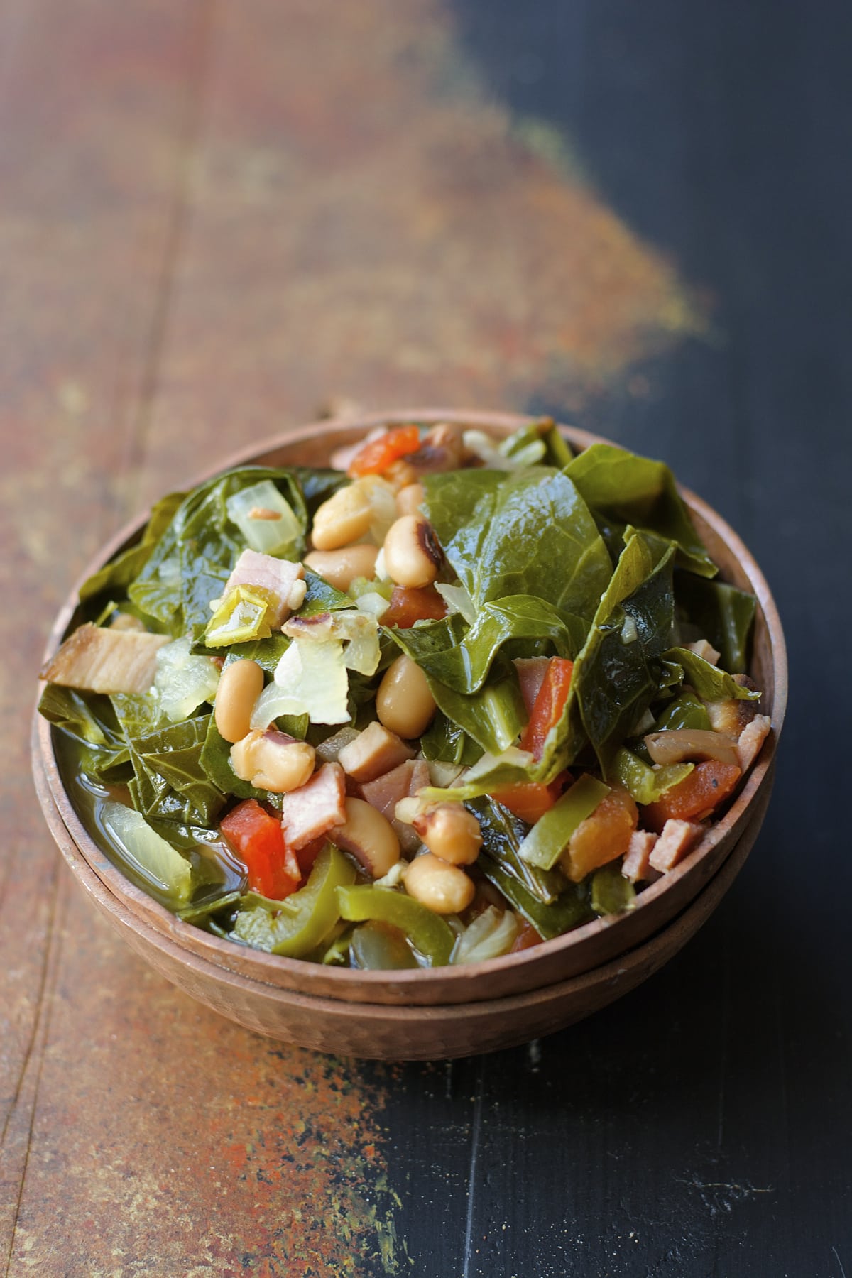 Crock Pot Black Eyed Peas and Collard Greens are the ultimate Southern comfort food! Tender greens, salty ham, and spicy jalapenos make the absolute best slow cooker meal.