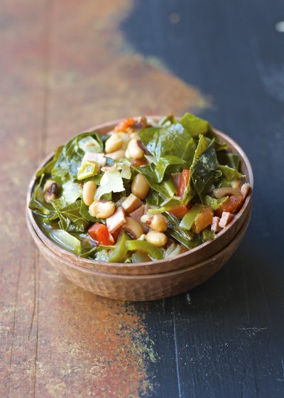 Crock Pot Black Eyed Peas and Collard Greens are the ultimate Southern comfort food! Tender greens, salty ham, and spicy jalapenos make the absolute best slow cooker meal.