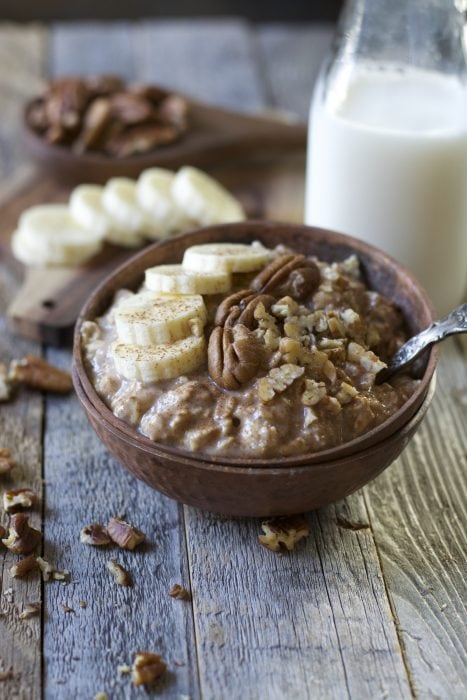 These easy Banana Overnight Oats are packed with sweet banana flavor, gluten free oats, cinnamon and maple syrup! A secret ingredient makes these a protein packed grab and go breakfast!