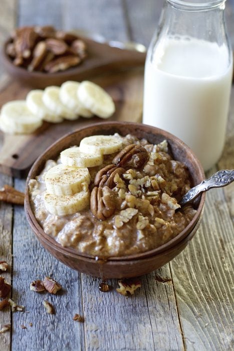 These easy Banana Overnight Oats are packed with sweet banana flavor, gluten free oats, cinnamon and maple syrup! A secret ingredient makes these a protein packed grab and go breakfast!