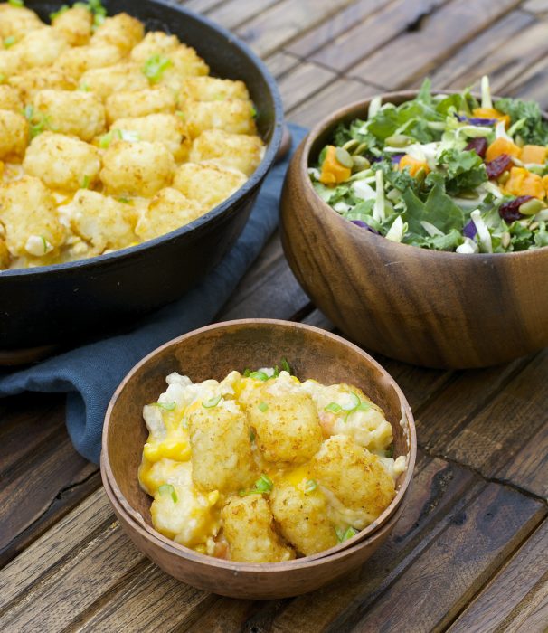 This Lightened Up Tater Tot Casserole is packed with lean ground turkey, loads of vegetables and a creamy homemade cheddar sauce! A perfect gluten free dinner for even your pickiest eaters! 