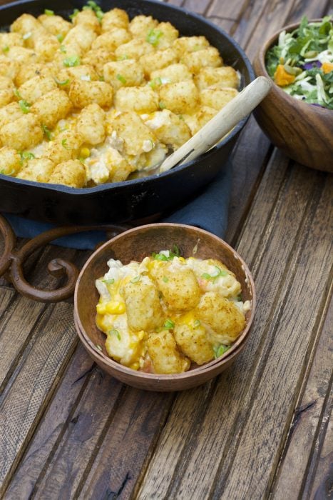 This Lightened Up Tater Tot Casserole is packed with lean ground turkey, loads of vegetables and a creamy homemade cheddar sauce! A perfect gluten free dinner for even your pickiest eaters!