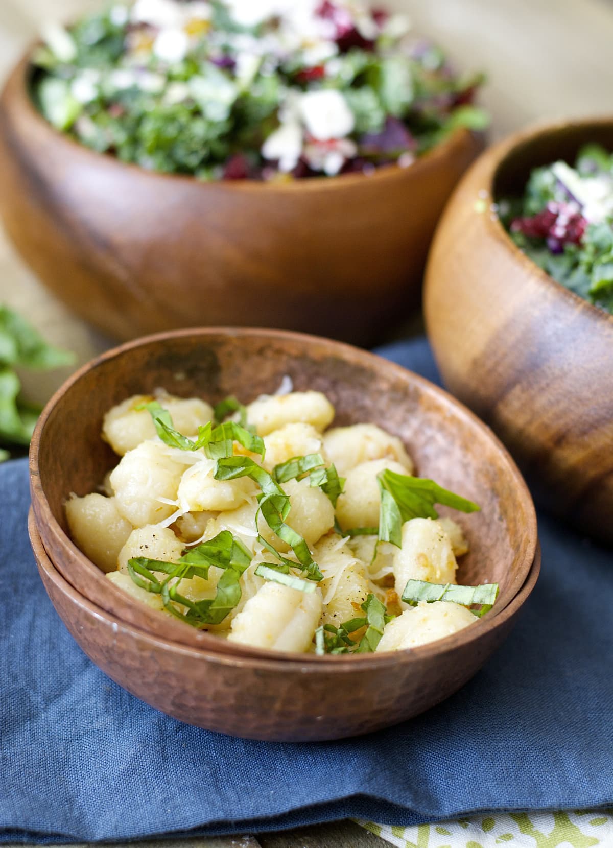 Gnocchi is sautéed in olive oil with freshly minced garlic until it is perfectly crisp then tossed with basil and parmesan! An easy dish ready in under 10 minutes!