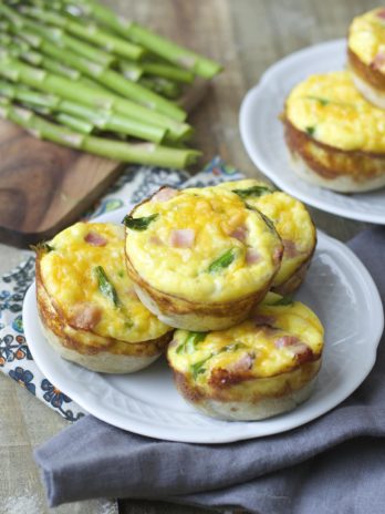Mini Quiche cups are packed with tender ham, fresh asparagus and sharp cheddar cheese for a easy Spring brunch!
