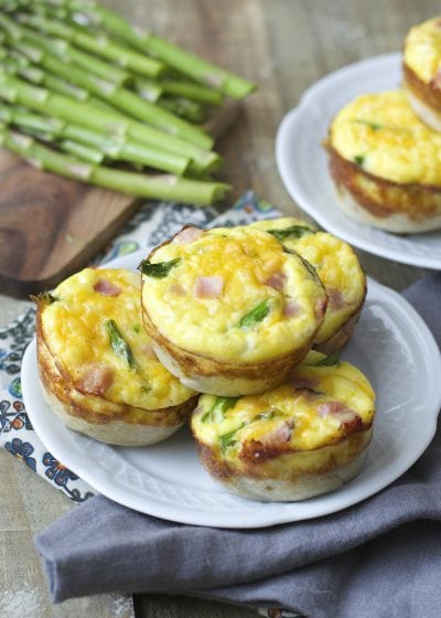 Mini Quiche cups are packed with tender ham, fresh asparagus and sharp cheddar cheese for a easy Spring brunch!