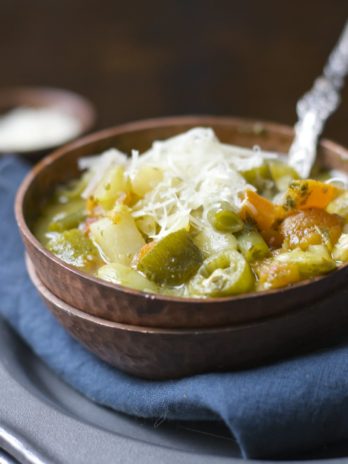 This simple five ingredient Creamy Pesto Veggie and Orzo Soup is vegan, gluten free and ready in under 20 minutes!