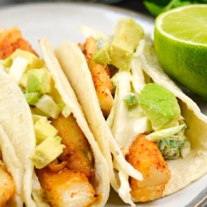 These light and healthy Easy Fish Tacos with Zesty Slaw are packed with flavor and ready in just 20 minutes! This dish is gluten free and perfect for busy weeknights!