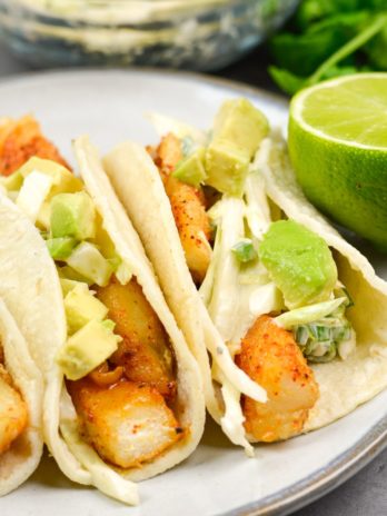 These light and healthy Easy Fish Tacos with Zesty Slaw are packed with flavor and ready in just 20 minutes! This dish is gluten free and perfect for busy weeknights!