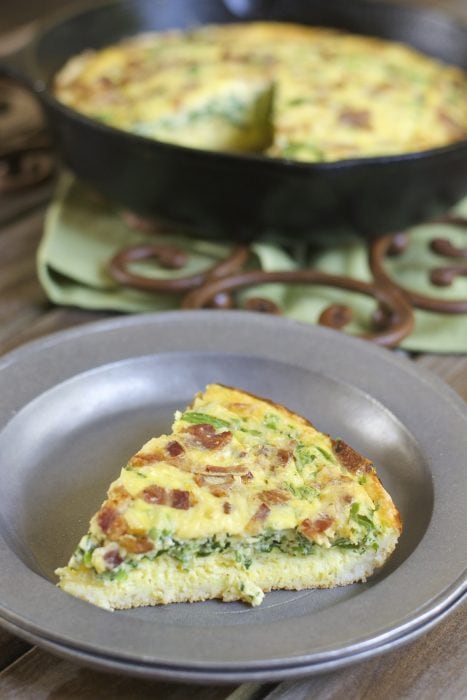 This Keto Bacon Jalapeno Quiche is an easy hearty dish your family will love! Loaded with crispy bacon, fresh jalapeño, shredded gouda and chopped spinach this will become a fast favorite!