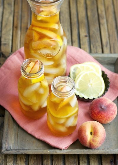 Sweet and refreshing Vanilla Peach Tea is the perfect Summer drink! Serve with fresh peach and lemon slices for simple Summer entertaining!