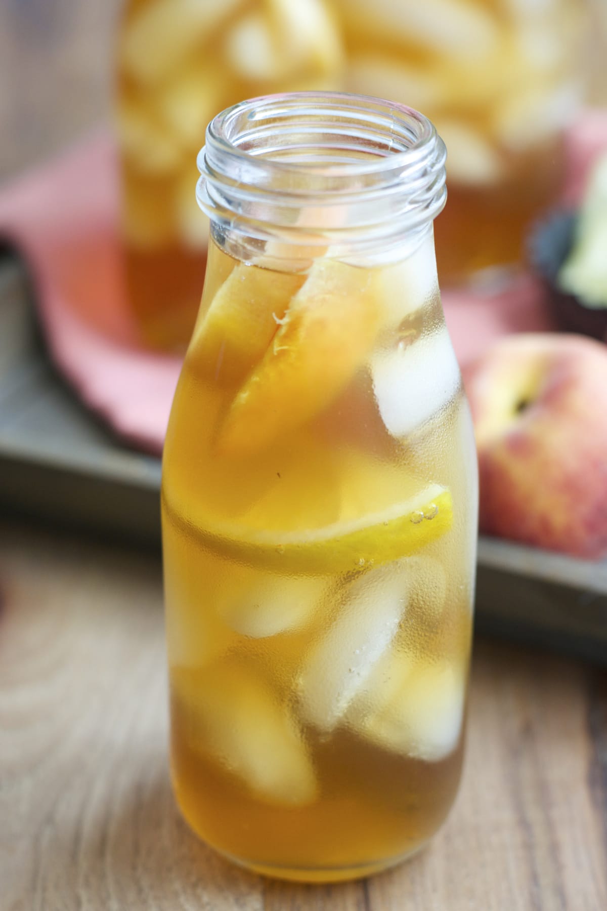 Sweet and refreshing Vanilla Peach Tea is the perfect Summer drink! Serve with fresh peach and lemon slices for simple Summer entertaining!