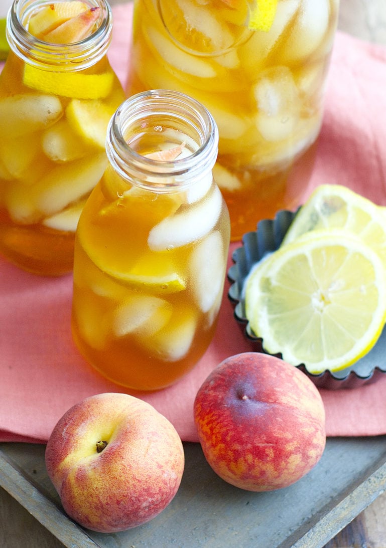 Sweet and refreshing Vanilla Peach Tea is the perfect Summer drink! Serve with fresh peach and lemon slices for simple Summer entertaining!