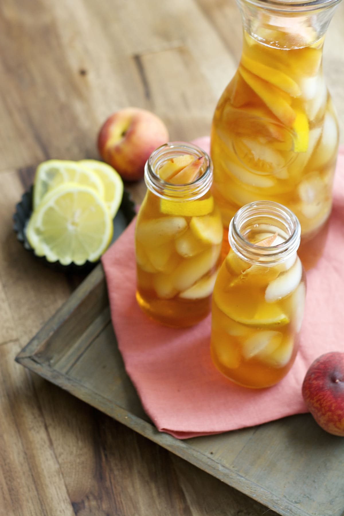 Sweet and refreshing Vanilla Peach Tea is the perfect Summer drink! Serve with fresh peach and lemon slices for simple Summer entertaining!