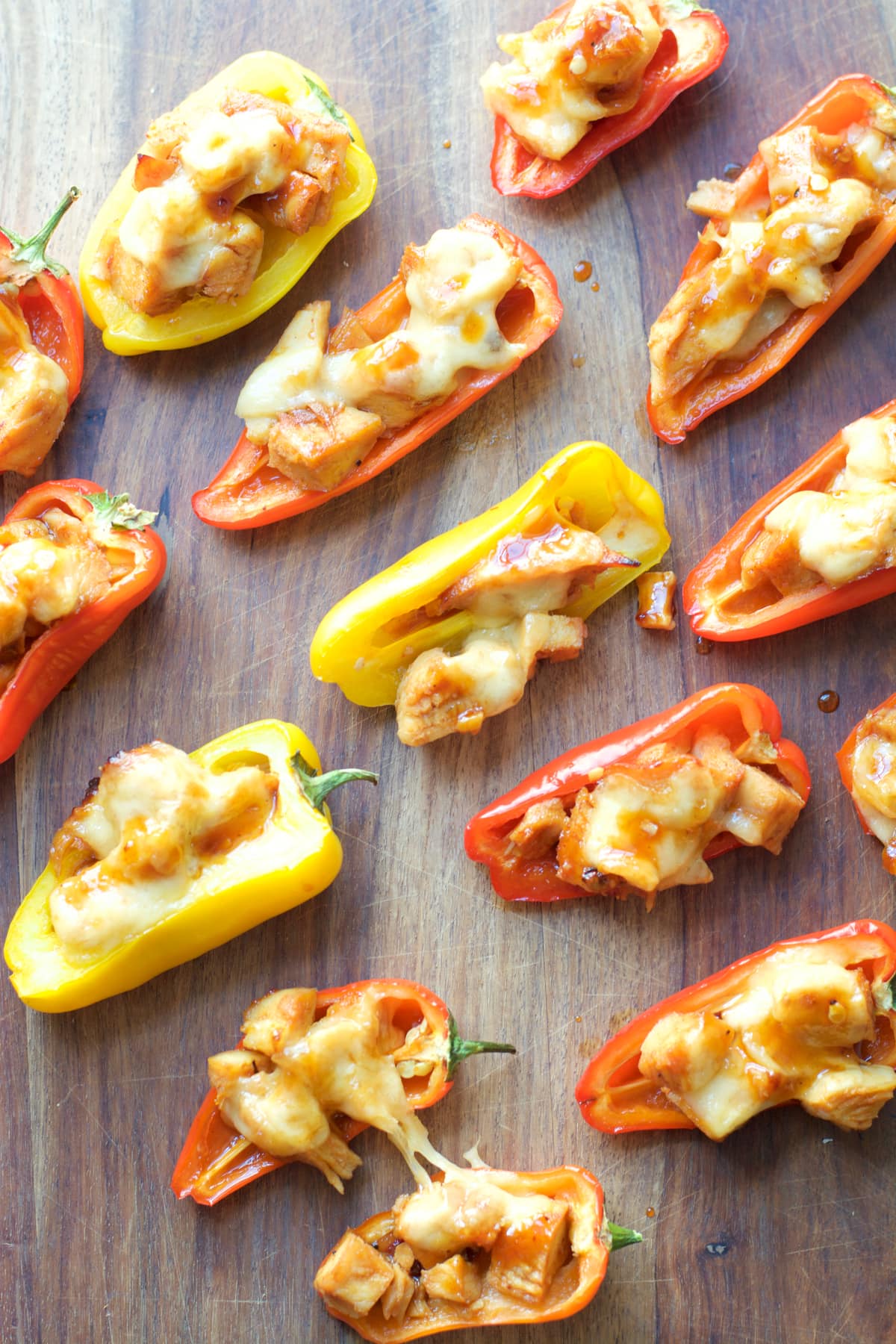 This simple six ingredient dish is perfect for Summer entertaining! Your guests will love these sweet and spicy Honey Chipotle Chicken and Gouda Stuffed Sweet Peppers!