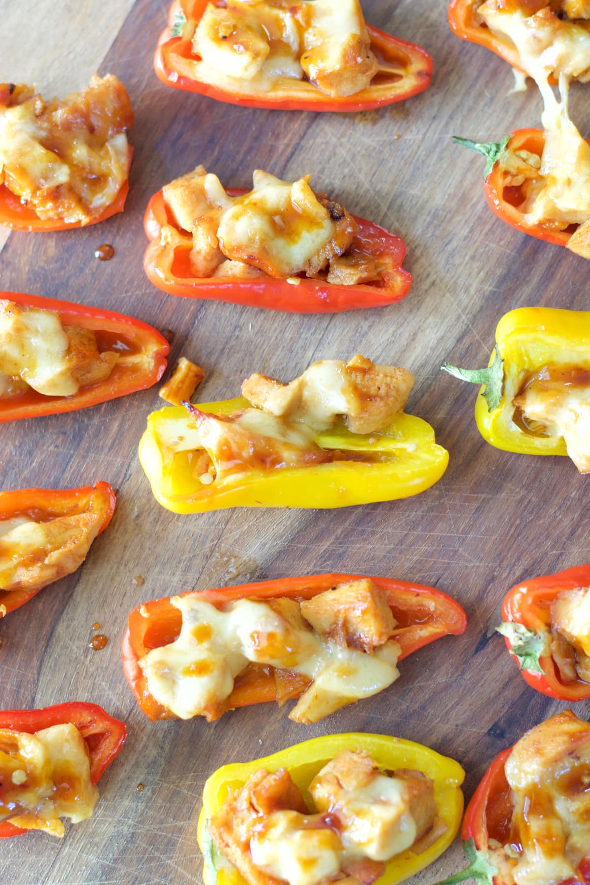 This simple six ingredient dish is perfect for Summer entertaining! Your guests will love these sweet and spicy Chipotle Chicken Stuffed Peppers!