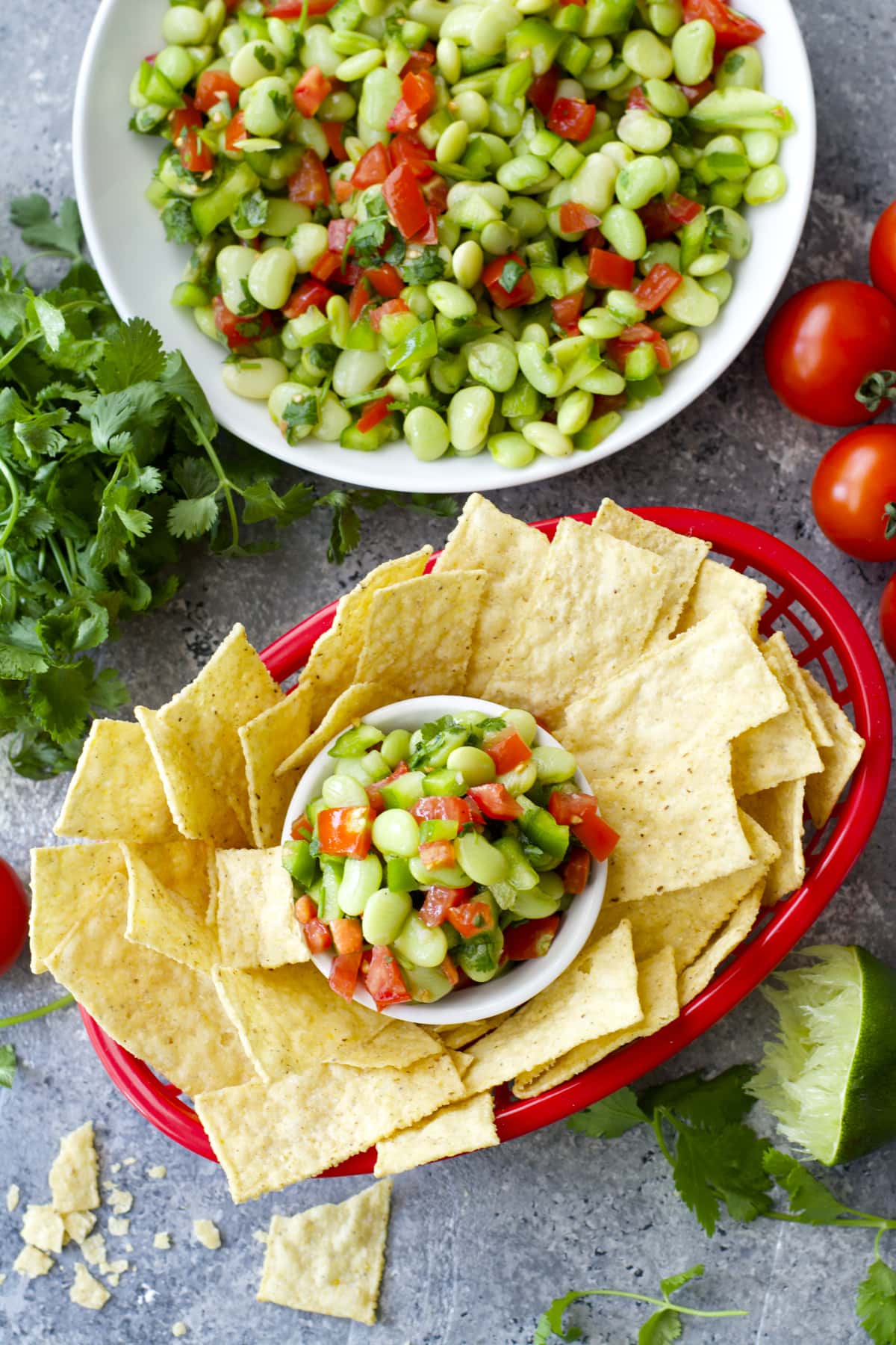Tender Lime Beans are combined with tomatoes and peppers and tossed in a zesty sauce! Grab some chips and get to snacking! You will love this easy Lima Bean Salsa!