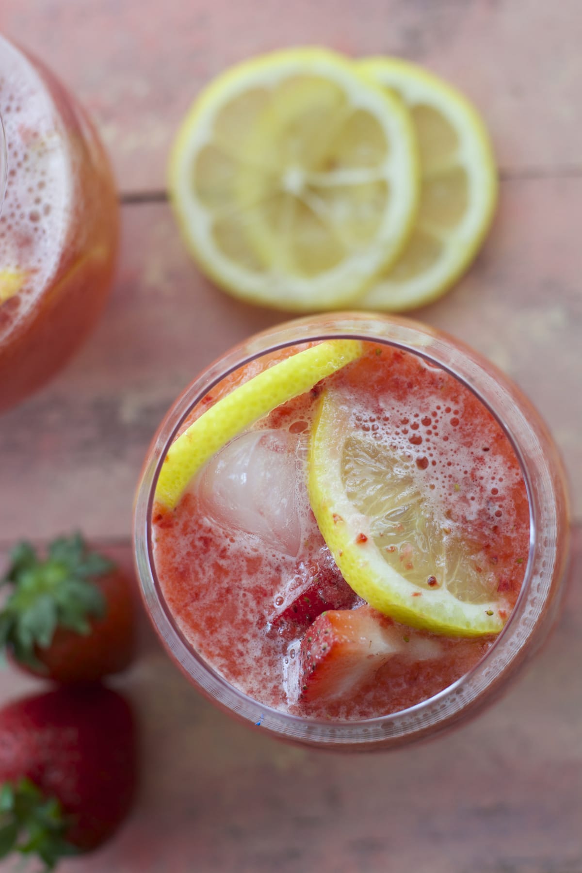 overhead view of a glass of homemade strawberry lemonade 