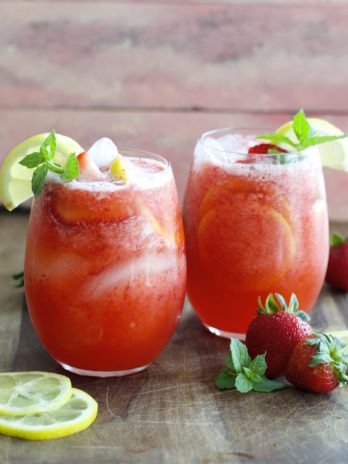 This refreshing Strawberry Lemonade is packed with fresh strawberries, lemon slices and mint and it is SO easy to make! It is the perfect way to beat the heat!