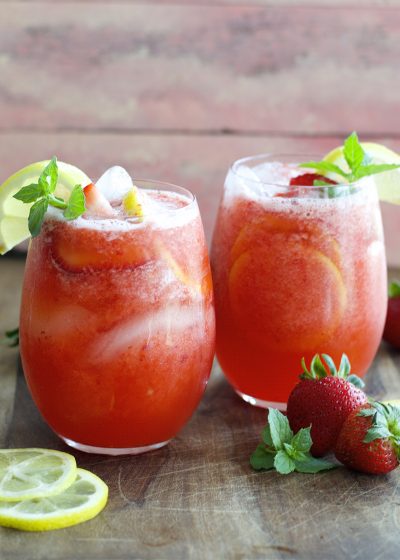 This refreshing Strawberry Lemonade is packed with fresh strawberries, lemon slices and mint and it is SO easy to make! It is the perfect way to beat the heat!