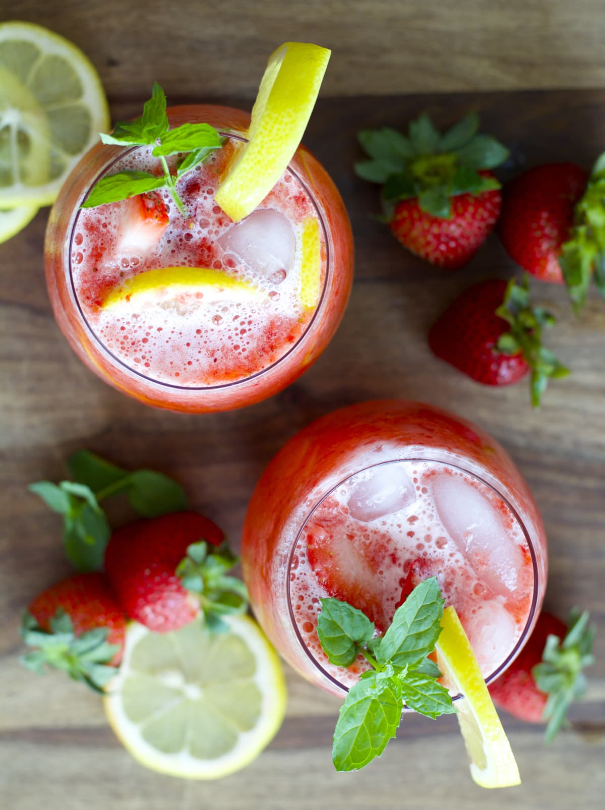 overhead view of two glasses of strawberry lemonade 