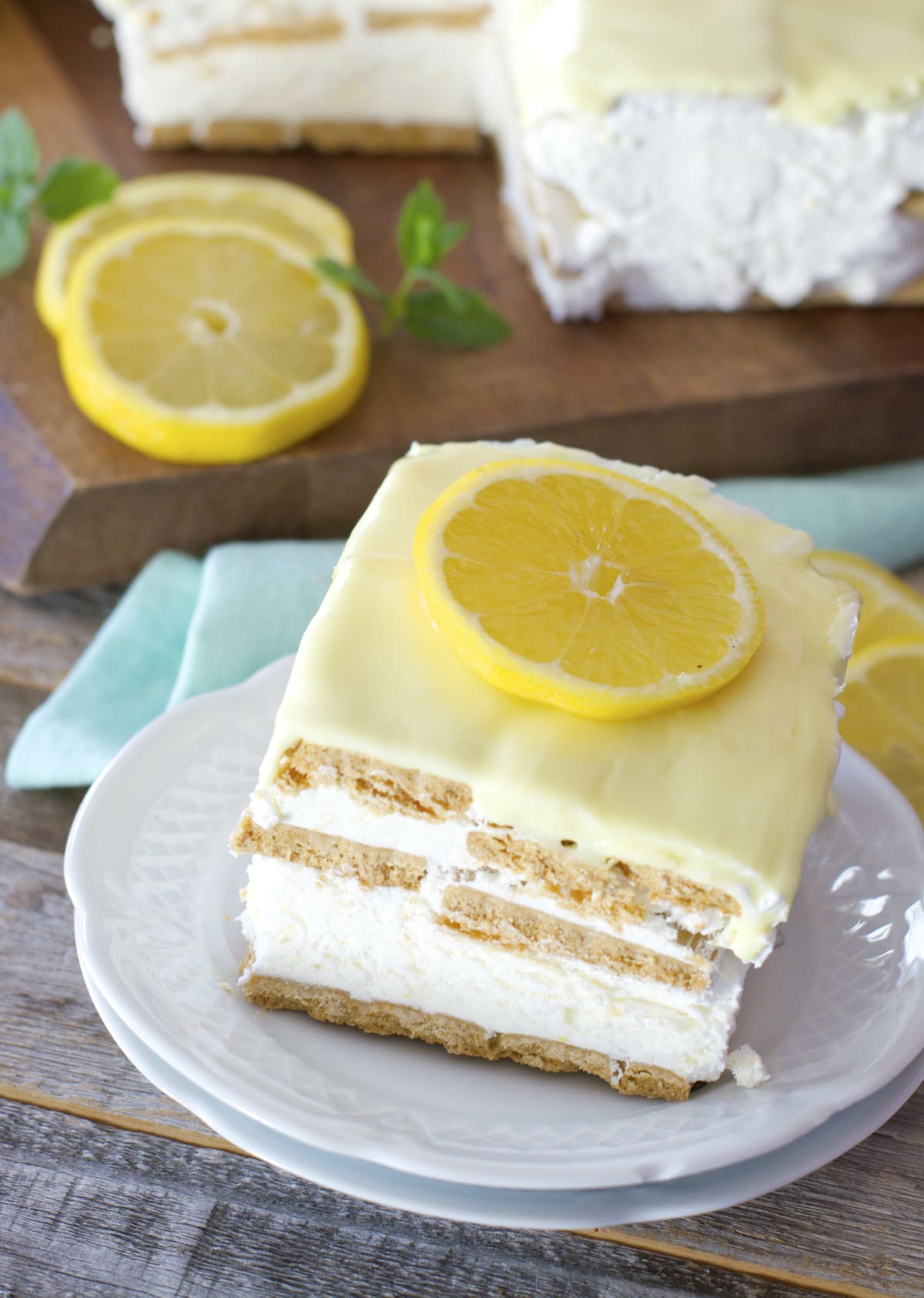 A slice of lemon icebox cake on two dessert plates 