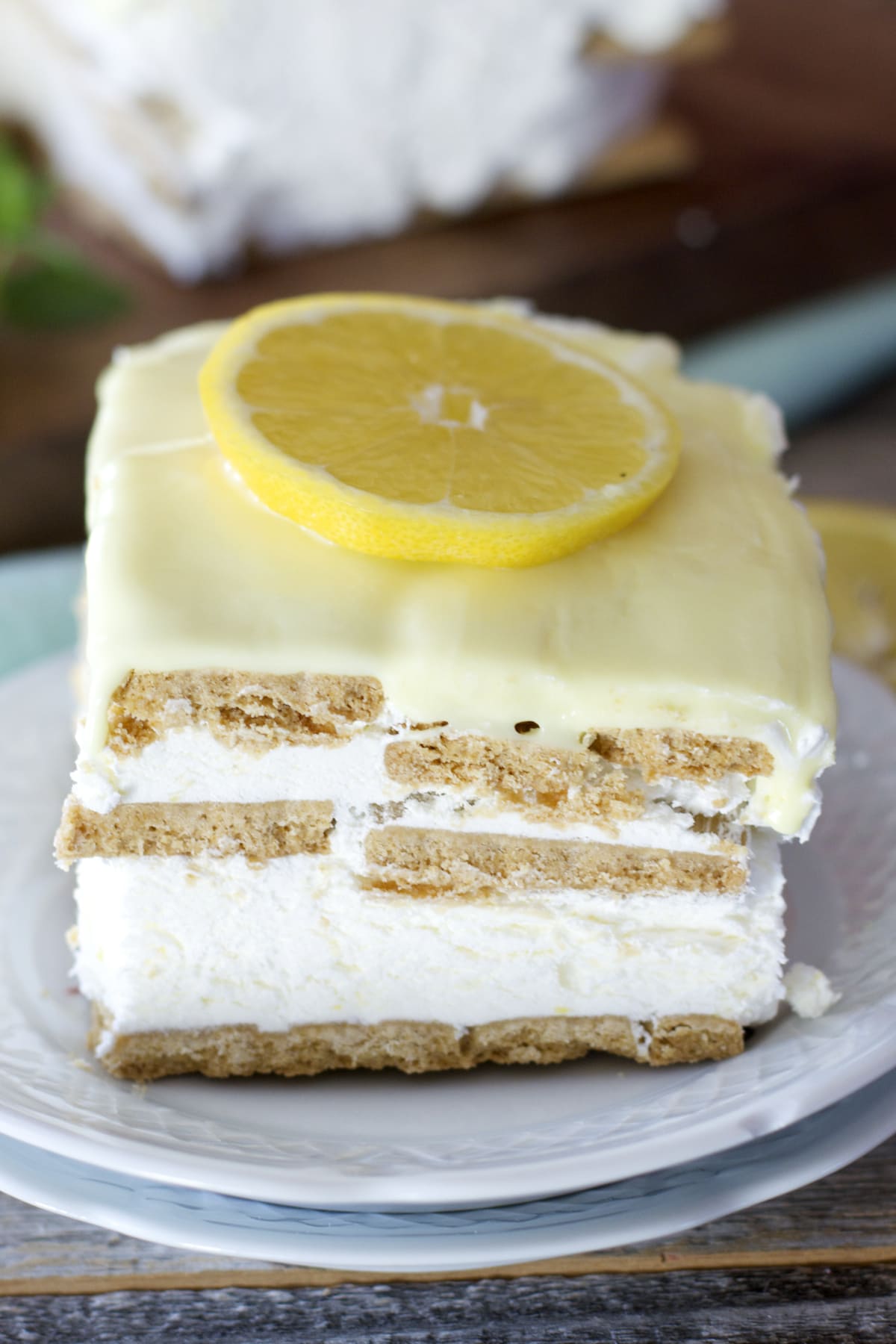 A slice of lemon icebox cake on a dessert plate. 