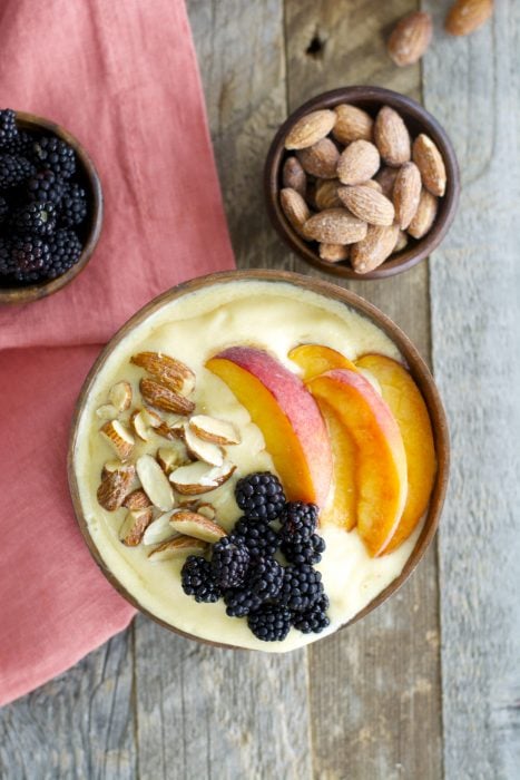 Sweet peaches, almond milk and a touch of vanilla and honey are blended until smooth and topped with crunchy granola for a hearty healthy breakfast! This easy Peach Smoothie Bowl will be a new favorite!