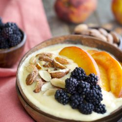 Sweet peaches, almond milk and a touch of vanilla and honey are blended until smooth and topped with crunchy granola for a hearty healthy breakfast! This easy Peach Smoothie Bowl will be a new favorite!