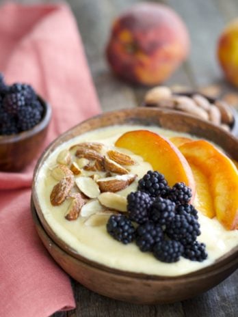 Sweet peaches, almond milk and a touch of vanilla and honey are blended until smooth and topped with crunchy granola for a hearty healthy breakfast! This easy Peach Smoothie Bowl will be a new favorite!
