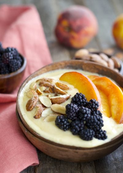 Sweet peaches, almond milk and a touch of vanilla and honey are blended until smooth and topped with crunchy granola for a hearty healthy breakfast! This easy Peach Smoothie Bowl will be a new favorite!