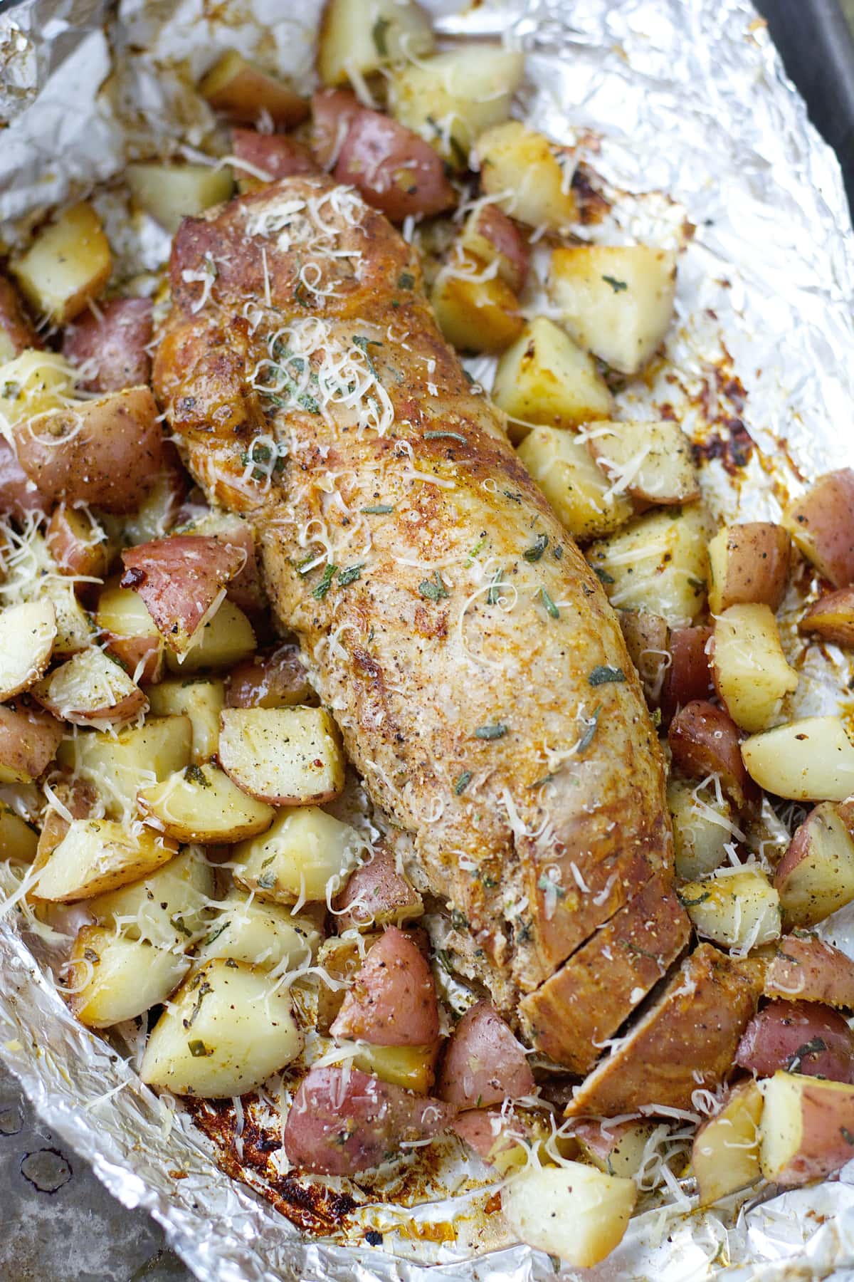 This easy Grilled Herb Crusted Potatoes and Pork Tenderloin Foil Packet is an effortless Summer meal perfect for busy weeknights!