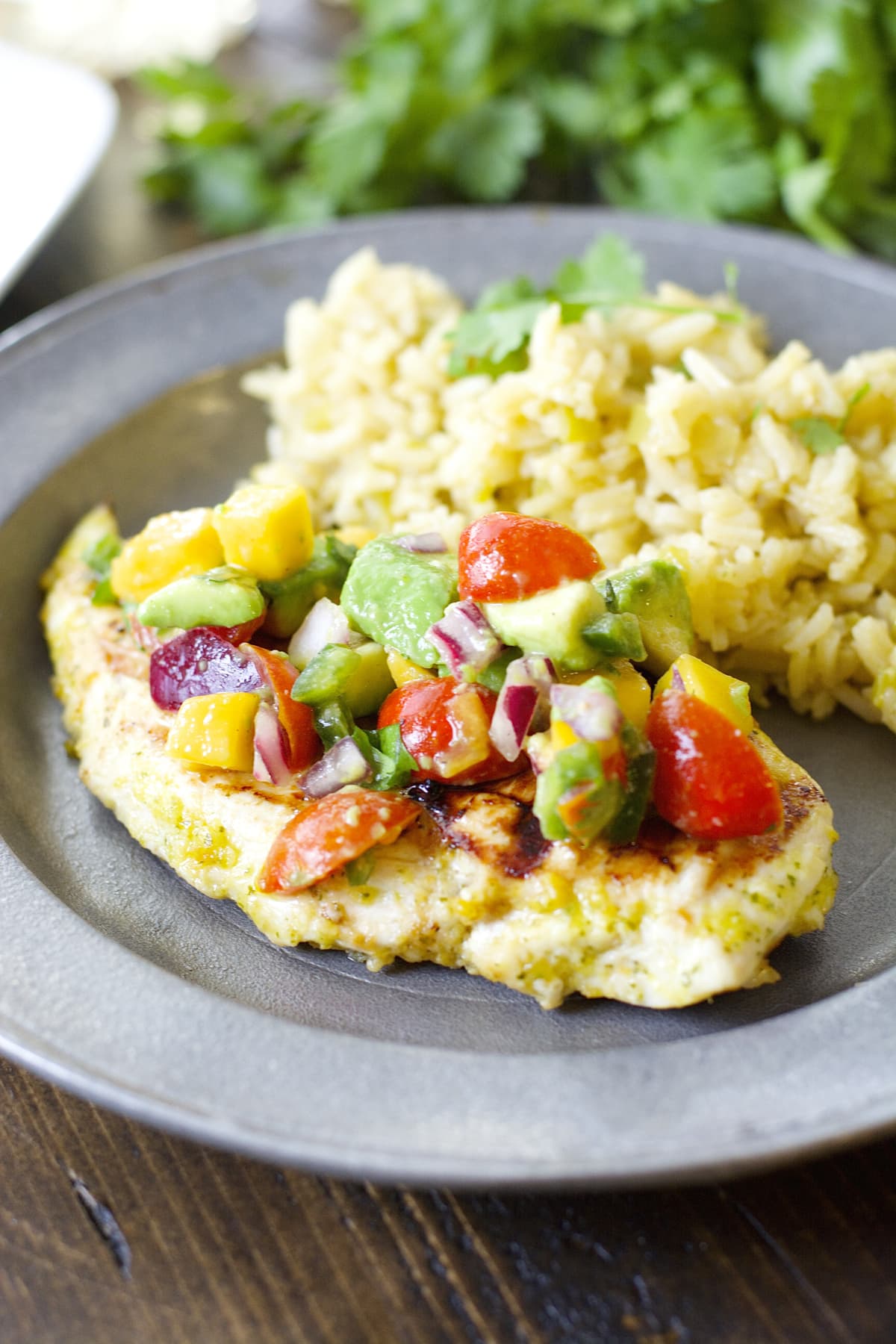 This Sweet and Spicy Habanero Chicken with Mango Salsa is grilled to perfection and packed with flavor!