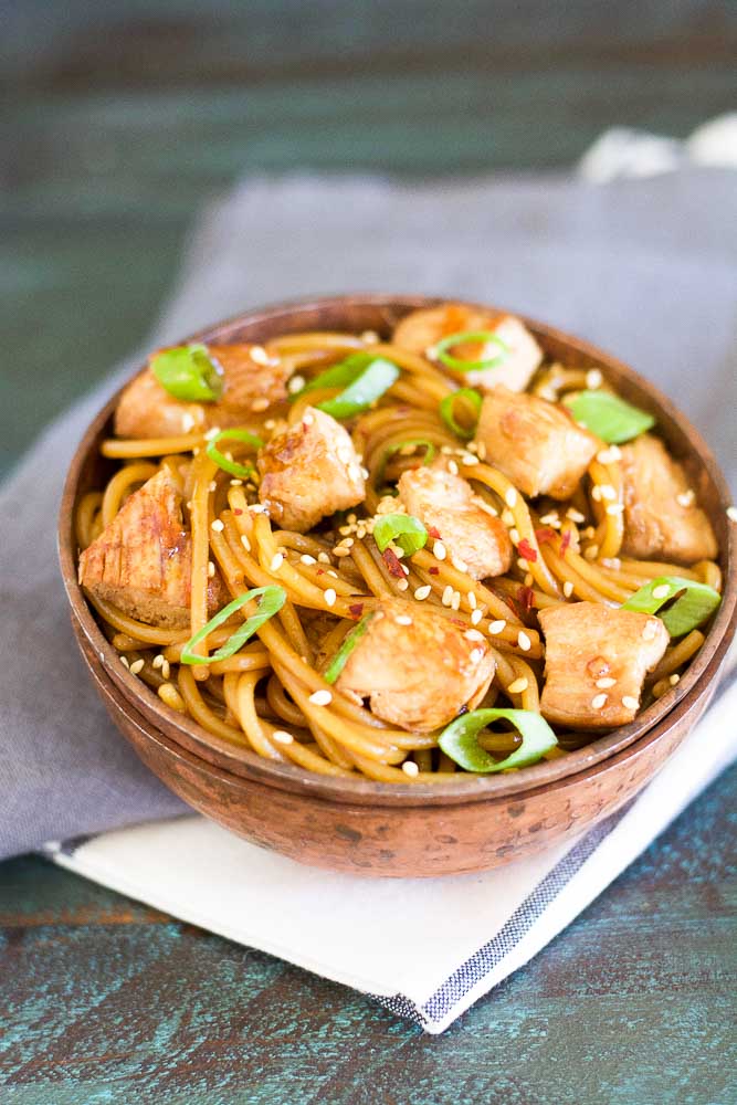 This Sesame Chicken Lo Mein is covered in a sweet sesame ginger and garlic sauce, easy to meal prep, and ready in under 30 minutes!
