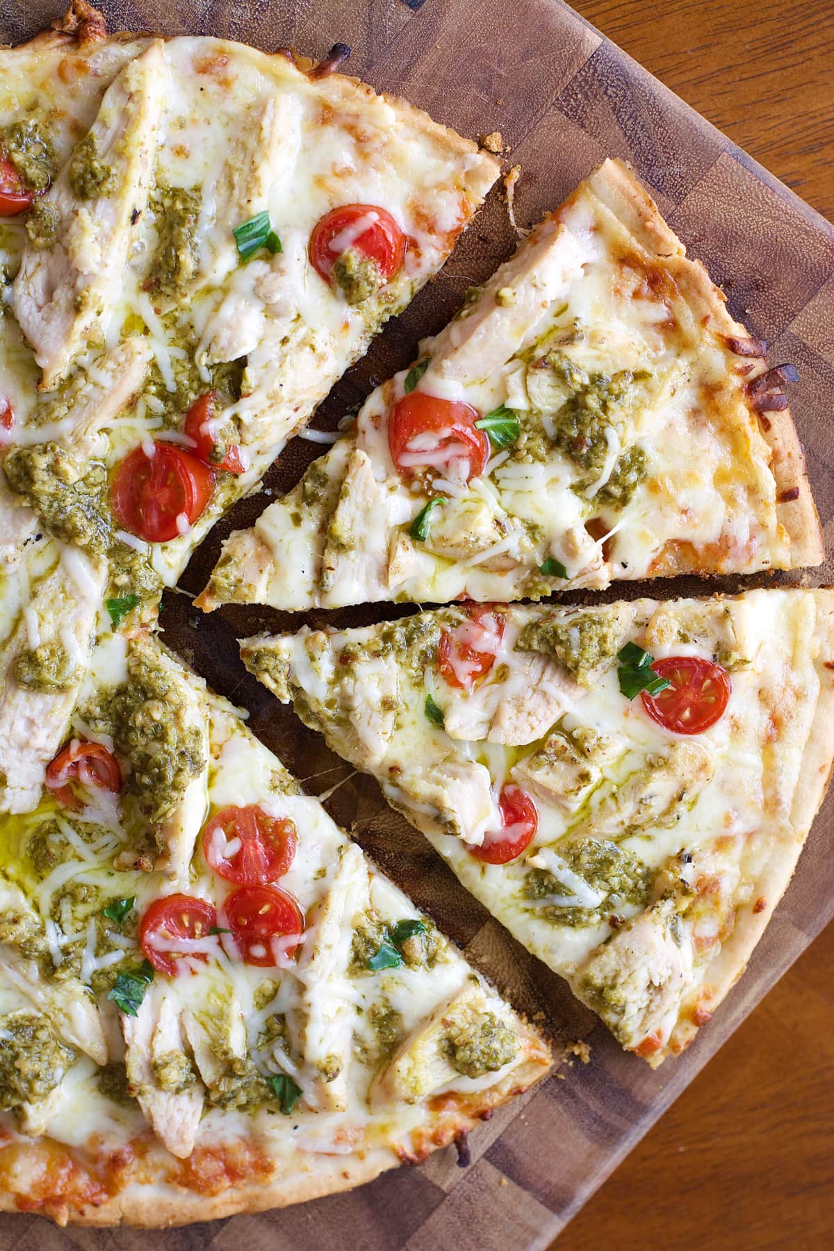 This easy four ingredient gluten free Grilled Pesto Chicken Pizza will make weeknight dinners a breeze!