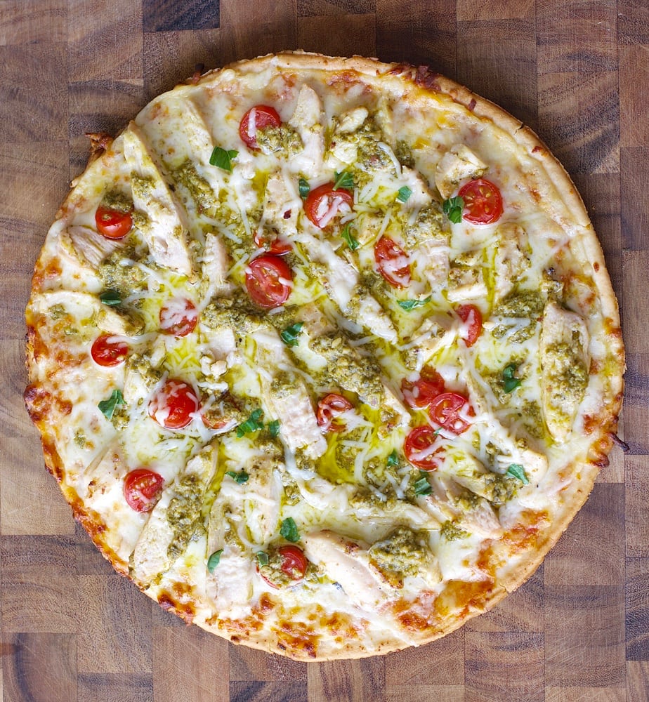 This easy four ingredient gluten free Grilled Pesto Chicken Pizza will make weeknight dinners a breeze!